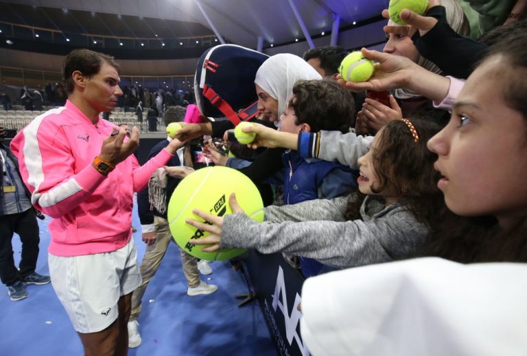 Rafael Nadal signing autographs during the launch of the new branch of his 'Rafa Nadal Tennis Academy' in Kuwait.