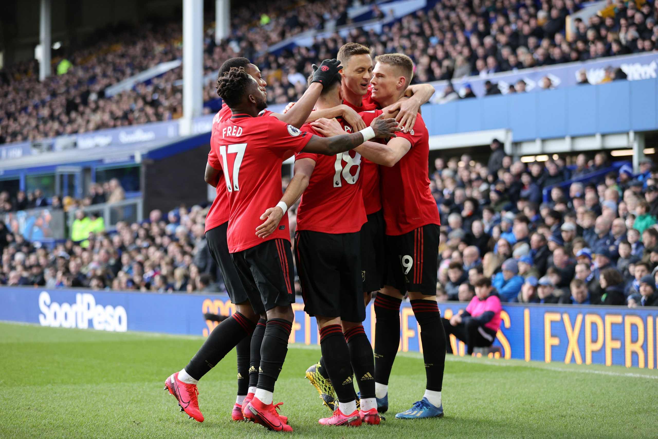 Manchester United players celebrate after scoring against Everton. (Getty Images)