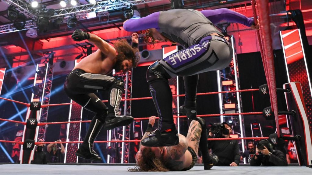 Seth Rollins and Murphy attack Aleister Black