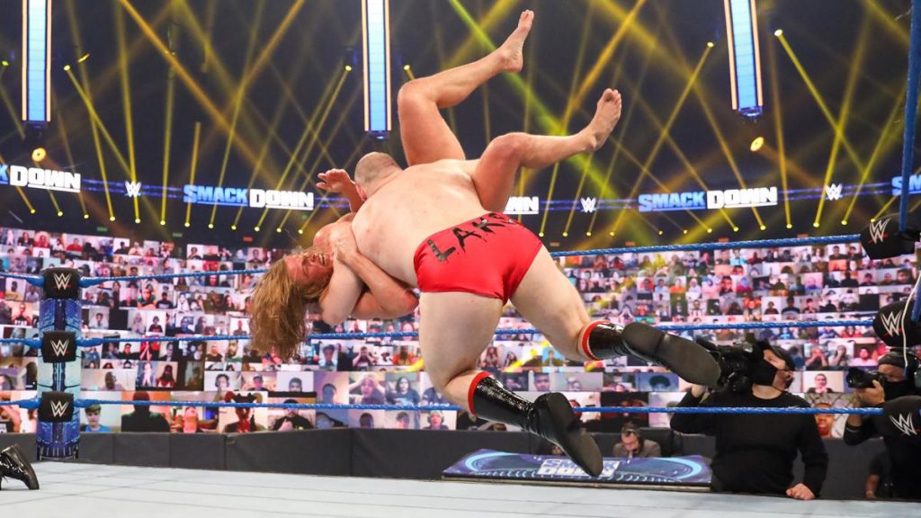 Lars Sullivan attacks Matt Riddle. (WWE)