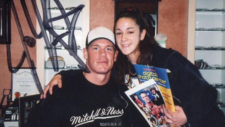 John Cena and Bayley during an early signing