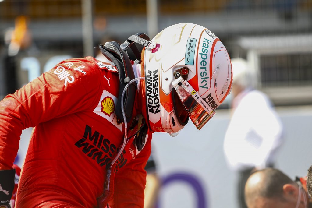 Charles Leclerc in Ferrari overalls