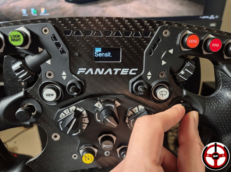 A person's finger on the Fanatec CSL DD