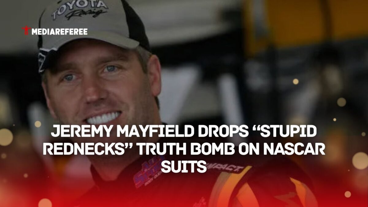 Jeremy Mayfield, driver of the Allsport Toyota, stands in the garage area during practice